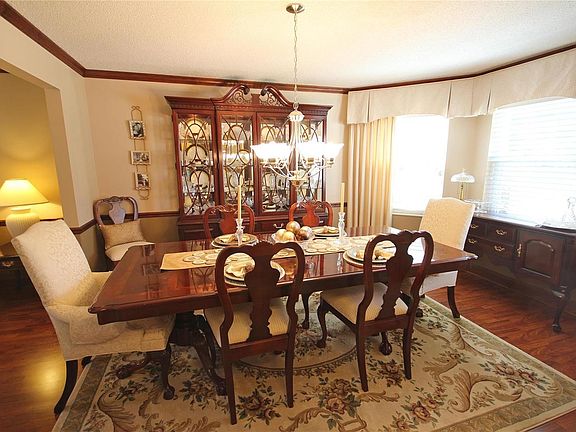 Large formal dining room with bay window.