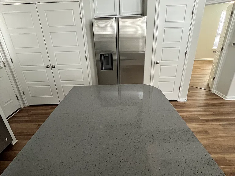 Kitchen Island & side by side refrigerator & freezer with water & ice dispenser on the door