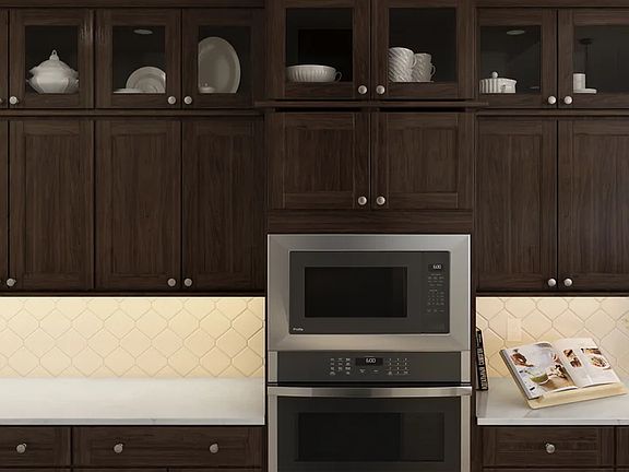 Kitchen with tile backsplash and glass upper cabinets
