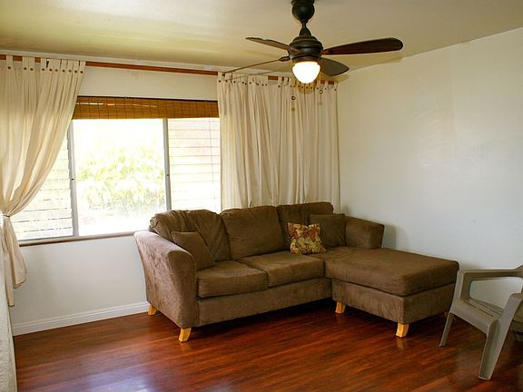 Newer wood laminate flooring throughout except in bathrooms