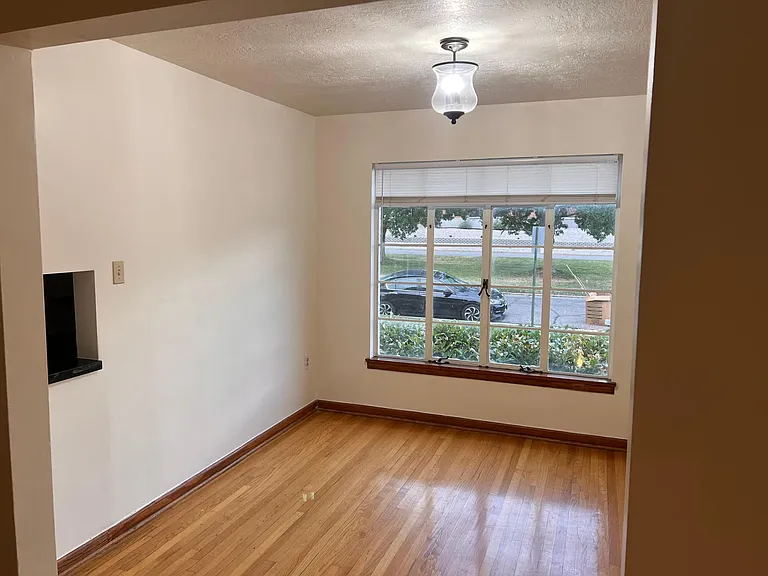Formal dining room with pass through from kitchen. Perfect study area.