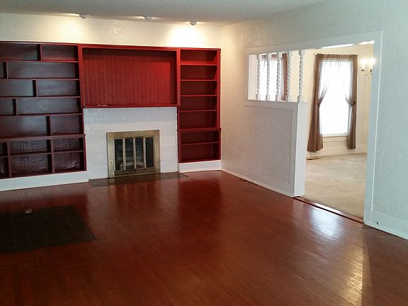 Living Room Decorative Fireplace and Bookshelf Wall