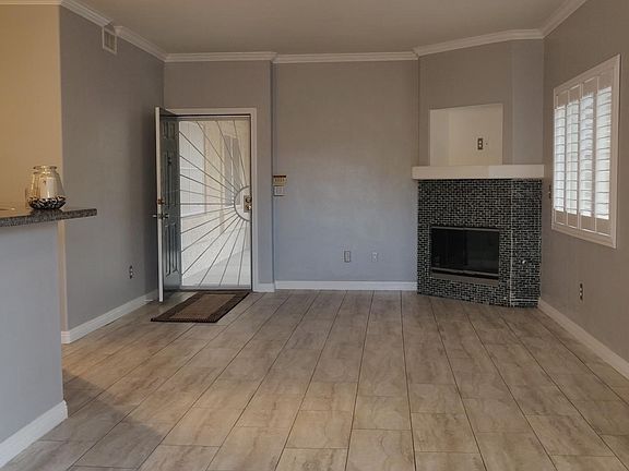 Living room, easy on gas fireplace, security door for great airflow.