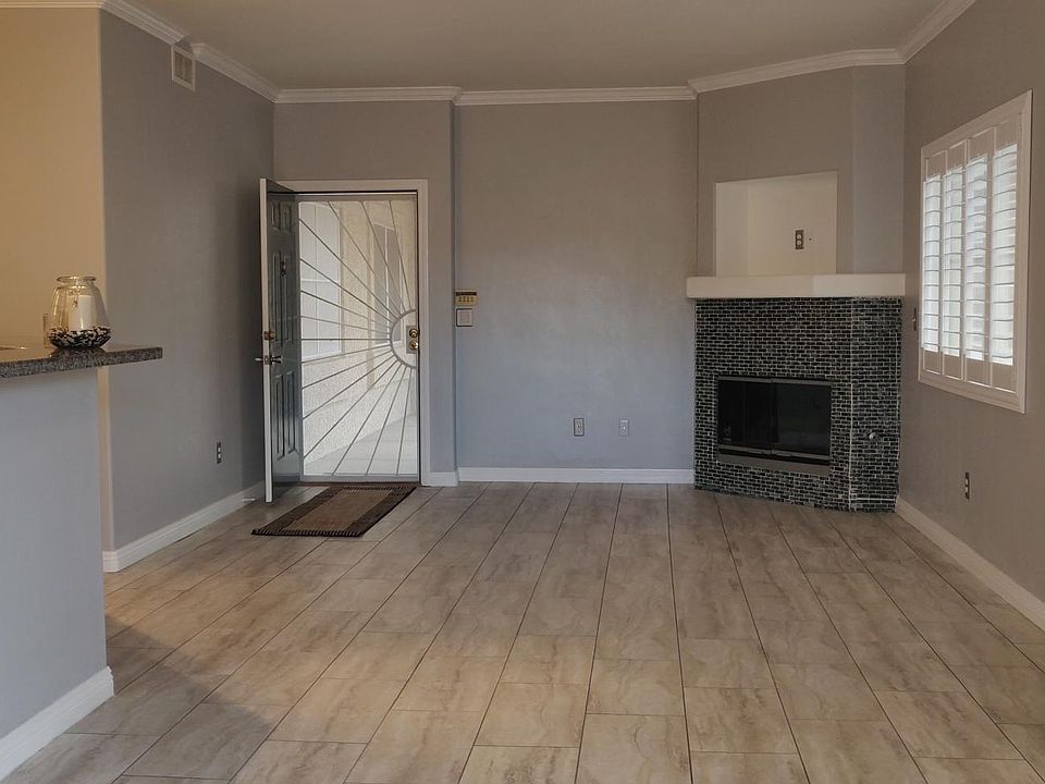 Living room, easy on gas fireplace, security door for great airflow.