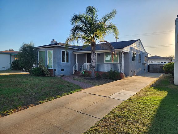 Front North side view, partial garage view