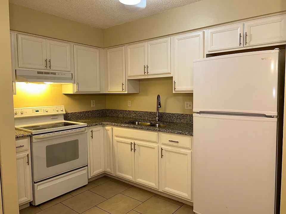 Kitchen with new cabinets, faucet, and new refrigerator