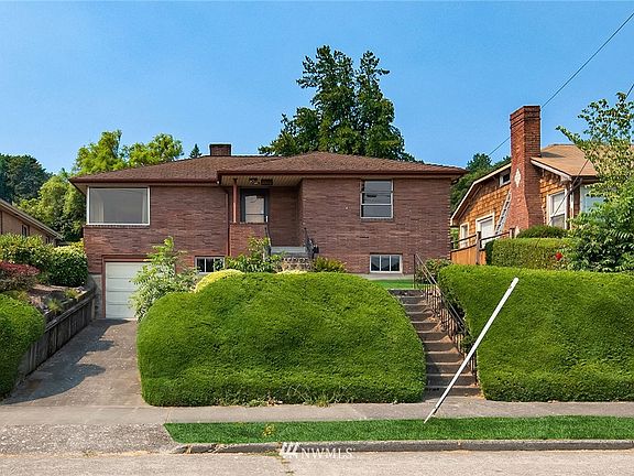 Located in one of Seattle's most sought out neighborhoods, it is time to make this mid-century, 1940's Magnolia spot the home of your dreams!