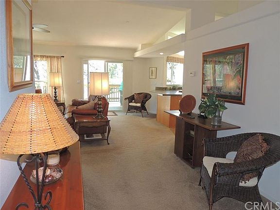 Entry leading to Living Room and Kitchen areas in rear of home