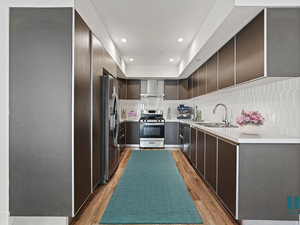 Kitchen with Energy-Efficient Appliances and Ample Cabinet Storage