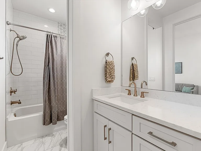 Upstairs bathroom serving secondary bedrooms.