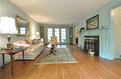 Living room with wood burning fireplace