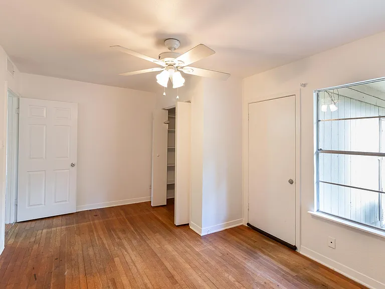 Primary bedroom. reach-in closet at back