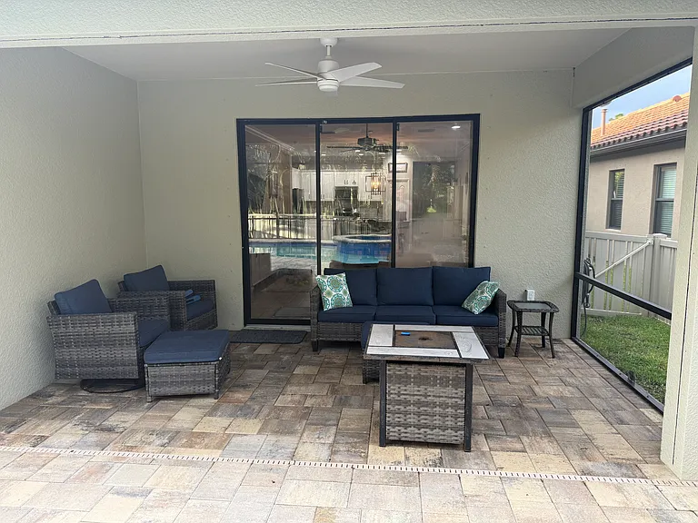 Covered sitting area (Lanai) on porch - fully screened in