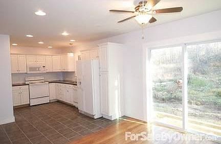 Living Room
						:
						Gorgeous stone fireplace, hardwood floors, French doors, raised panel walls.
