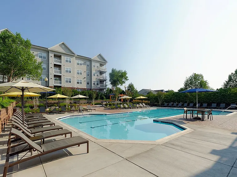 Swimming pool and sundeck with lounge seating