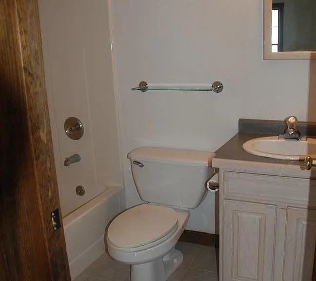 One of 2 downstairs bathrooms. 3rd bathroom upstairs