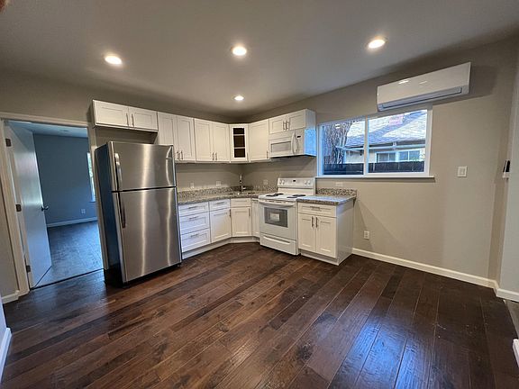 door leads to larger bedroom