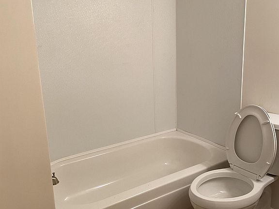 Upstairs full bath has a shower/tub combo.