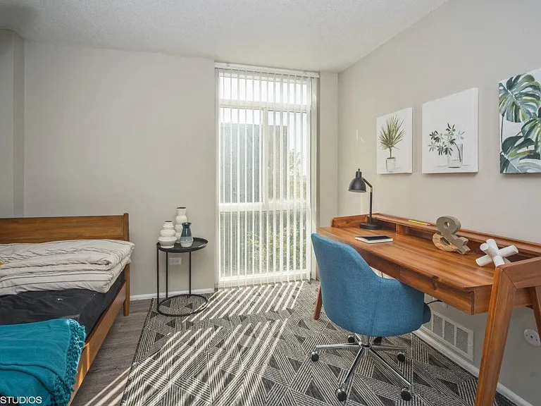 Bedroom with upgraded wood plank flooring