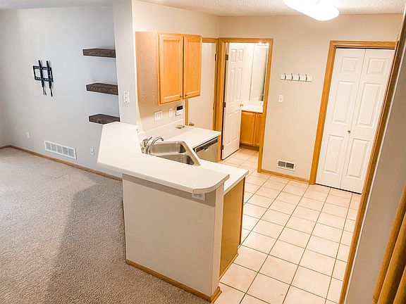 Kitchen and half bath - door next to the bathroom goes to the garage