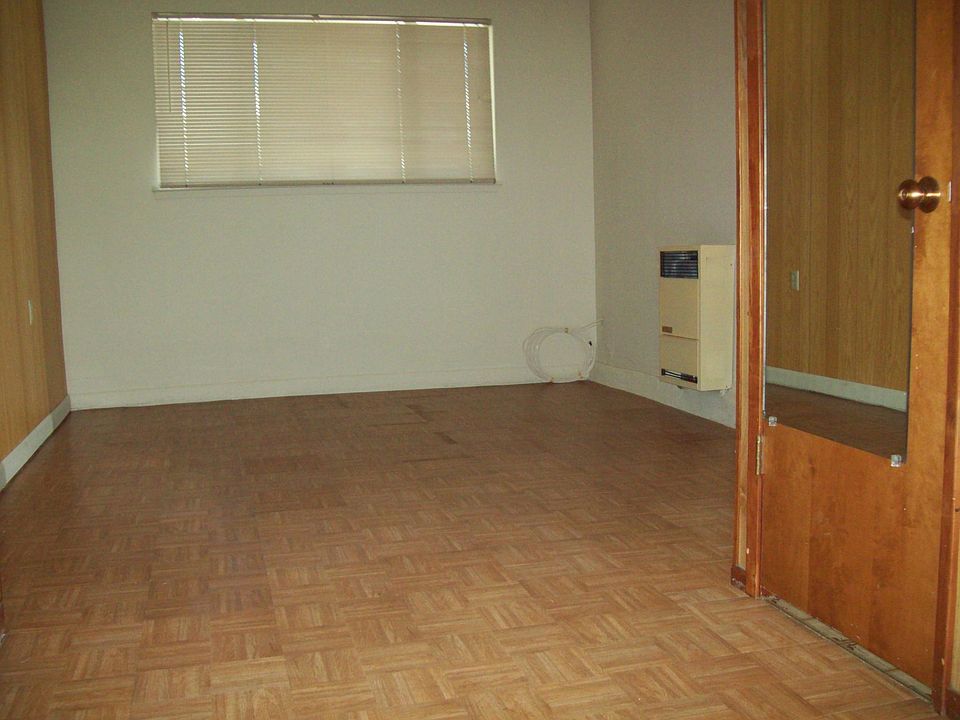 Vinyl floor, heater, mirror on bathroom.