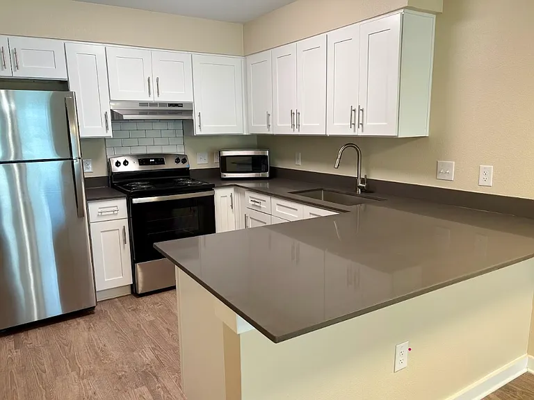 Brand New Construction Building with quartz countertops and top of the line finishes.