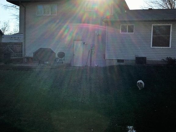 Fenced back yard with deck for relaxingl