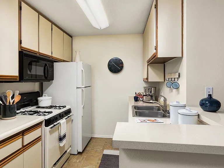 Classic I kitchen with white-on-white appliances and breakfast bars