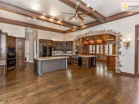 Hearth opens to Kitchen and Living Room