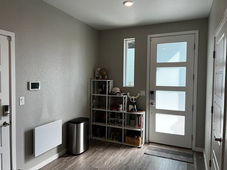 Entry area with plenty of light and access to the large 2 car garage to the left