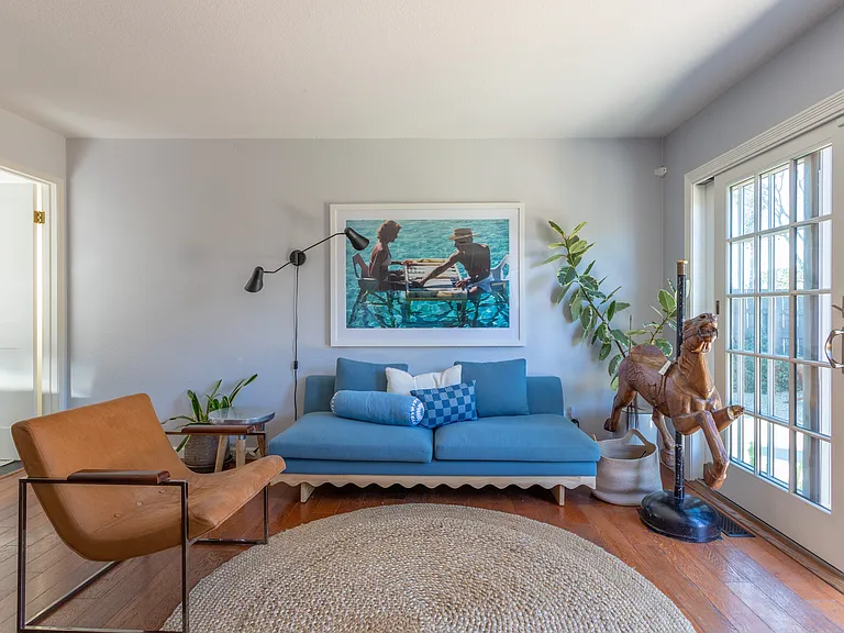 Off kitchen seating with small wall TV