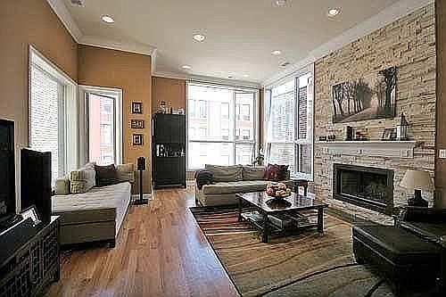 Tall ceilings reach over 11 feet in the main living space! Enjoy the warmth of a wood-burning fireplace with gas log lighter.