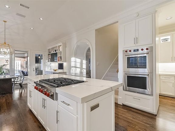 Chef inspired kitchen was remodeled in 2018 (per seller) with 2 inch Quartzite counter-tops, Wolf appliances, Hoshizaki ice maker and Sub-Zero refrigerator. The butler's pantry to the right offers additional storage and leads to the formal dining room.