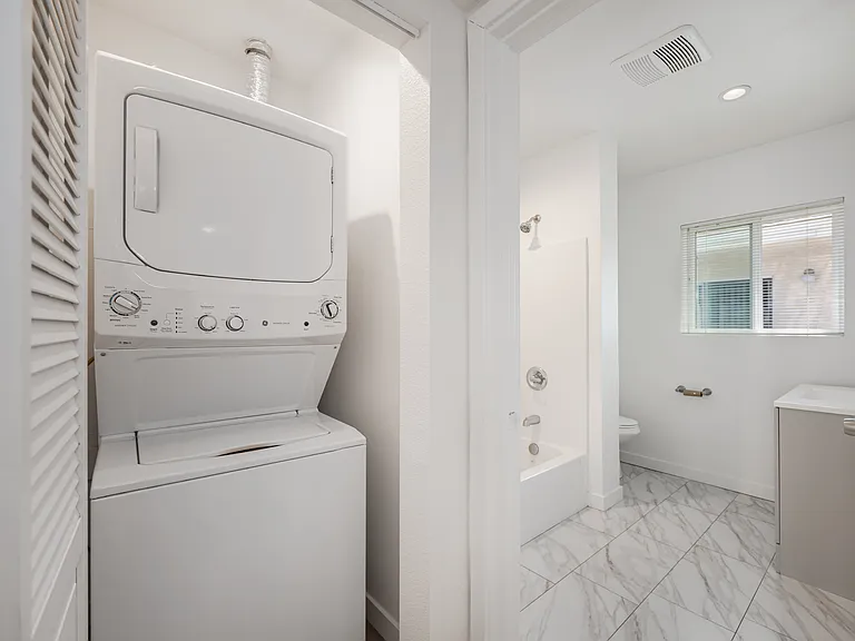 Washer & Dryer Closet leading towards Bathroom