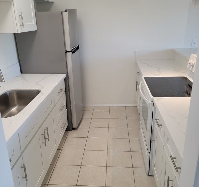 Completely remodeled kitchen with new cabinets, quartz counter.