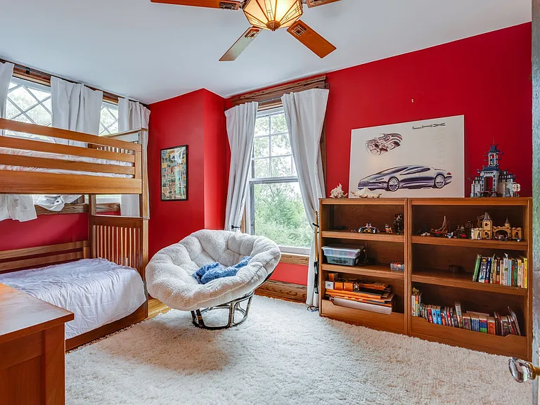 Bedroom 4 with bunk beds and large windows.