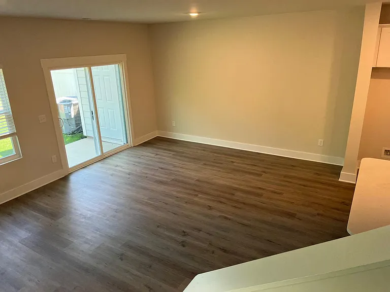 view from stairs to living/dining room