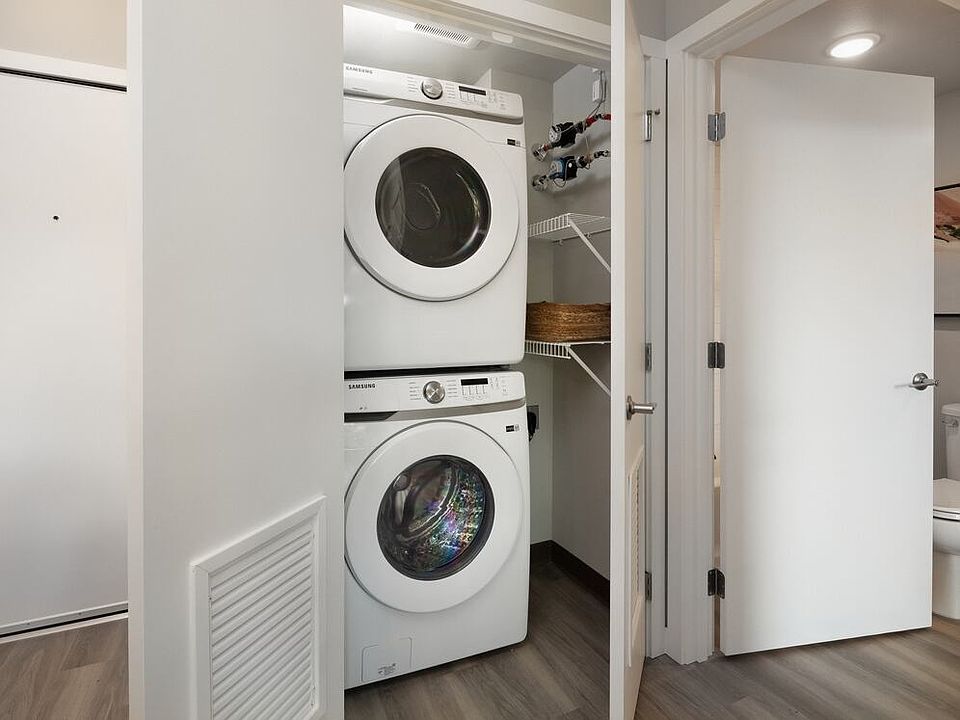 Stacking washer and dryer in every unit