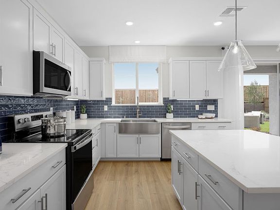 Open kitchen with decorative lighting