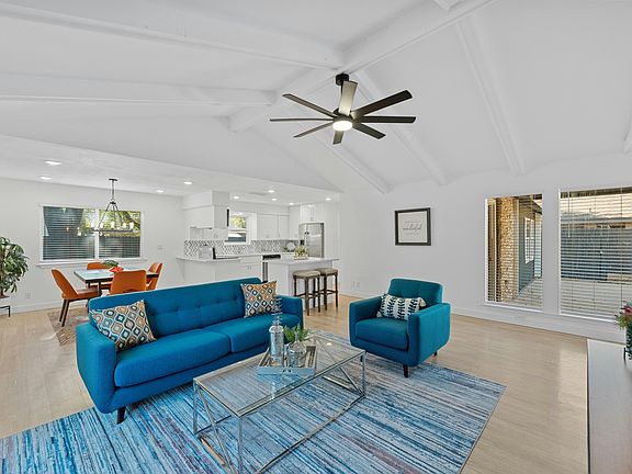 Family room open to kitchen and dining.