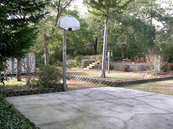 Back Yard Setting w/Basketball Hoop