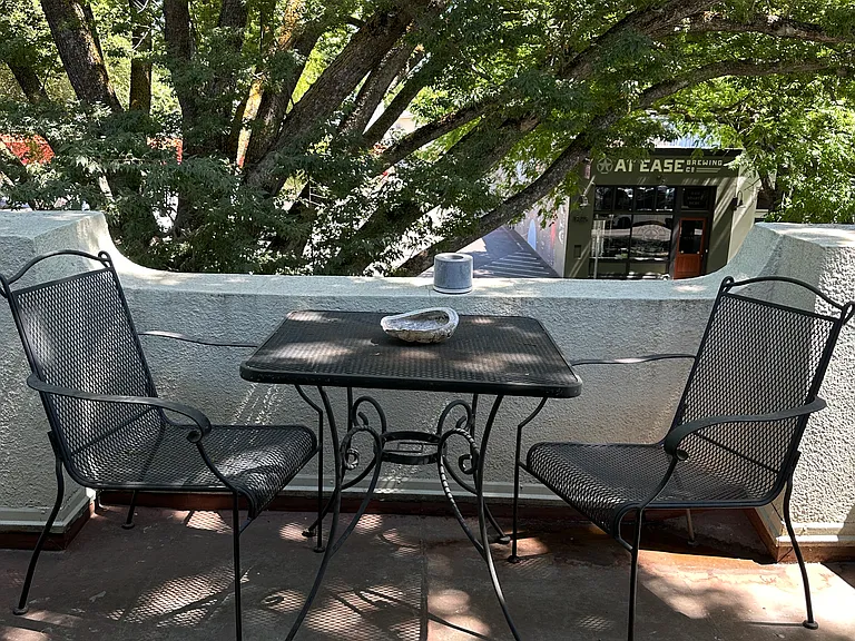 Shared upstairs balcony through French doors.