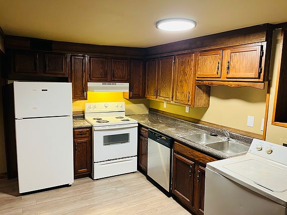 Kitchen area with washer/dryer located to the right.
