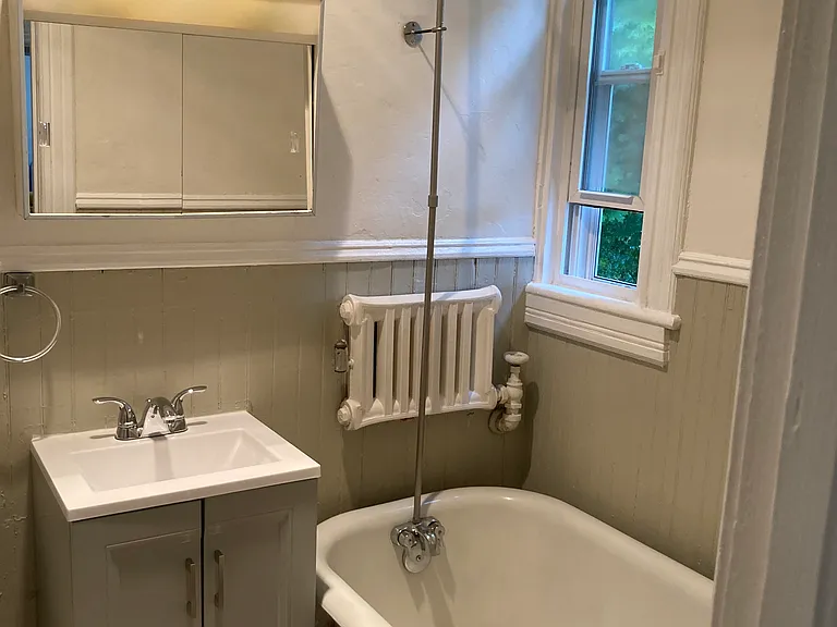 Bathroom with clawfoot tub and shower