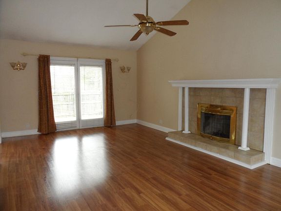 Living Room with Fireplace. Lots of windows.