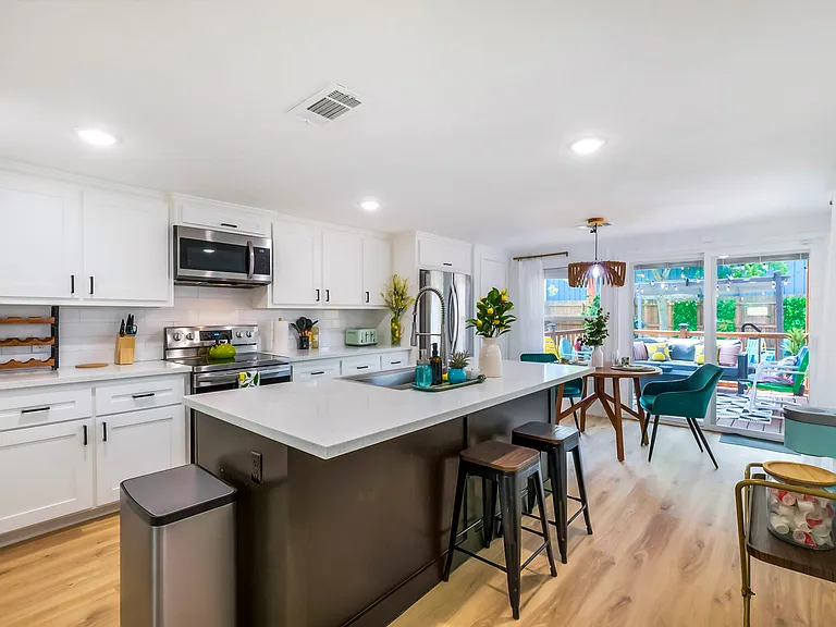 Spacious kitchen overseeing the backyard