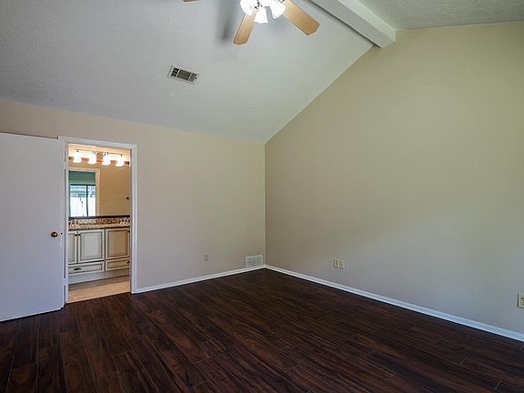 Spacious master bedroom with beautiful double glass door to wide back yard.