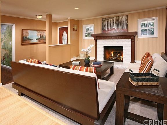 The living room is bathed in natural light from a