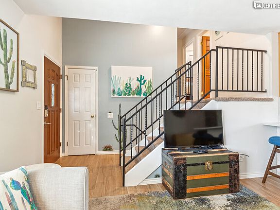 Entryway, half flight of stairs to upper and lower level