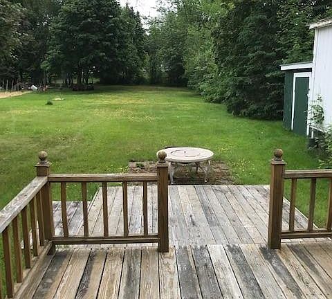 backyard extends to the Millinocket Stream